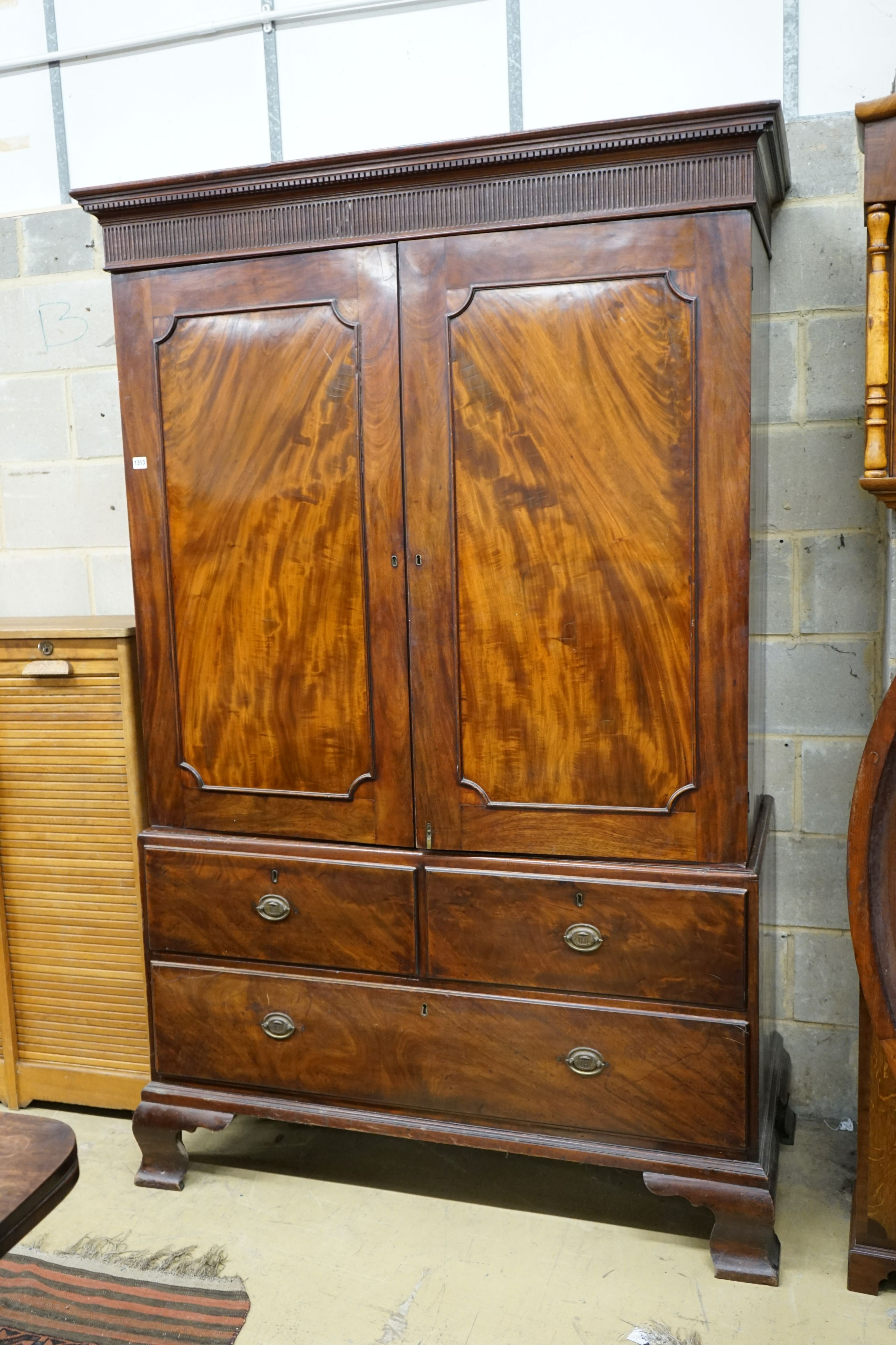 A George III mahogany linen press, width 130cm, depth 58cm, height 208cm